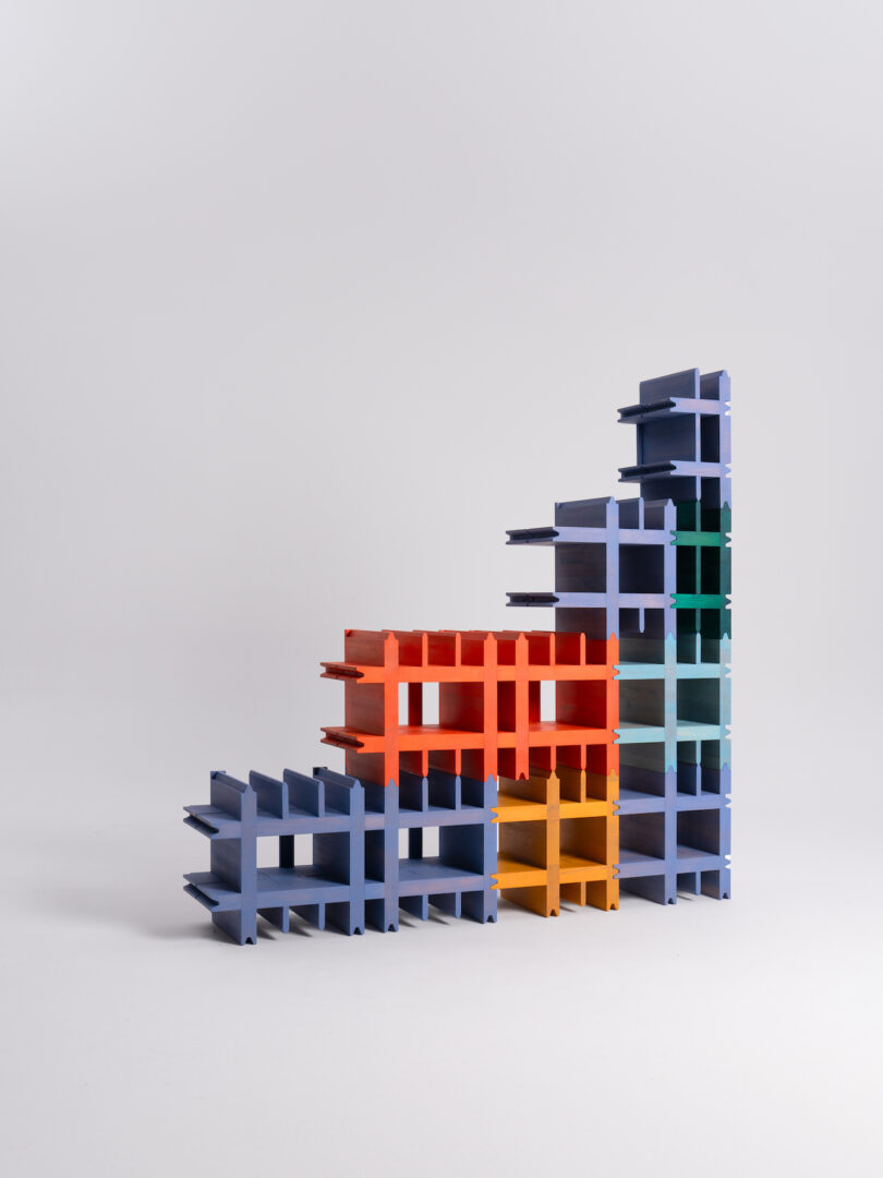 A set of colorful, interlocking modular shelves arranged in a tiered formation against a plain white background