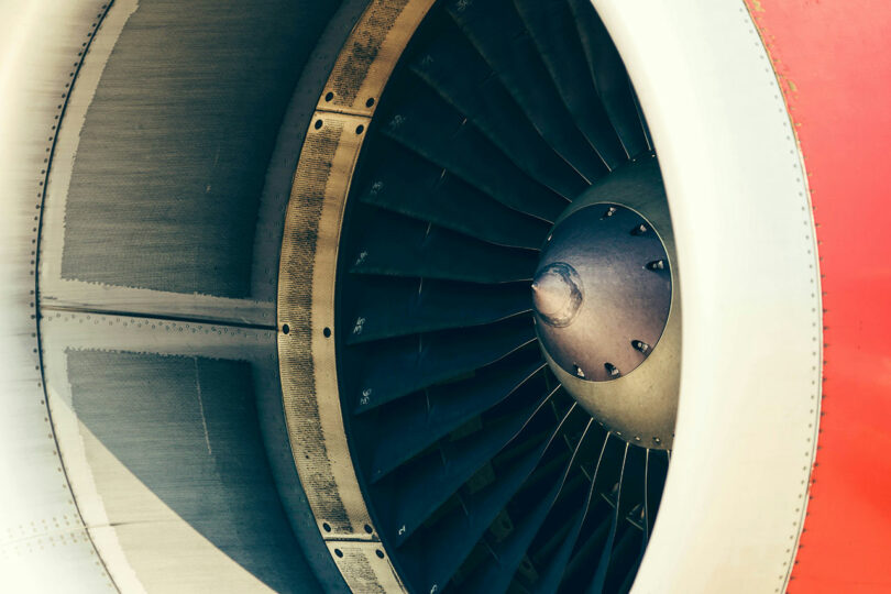 Close-up view of an aircraft engine's turbine blades and intake, highlighting the industrial design and engineering synonymous with Dan Harden's innovative approach.