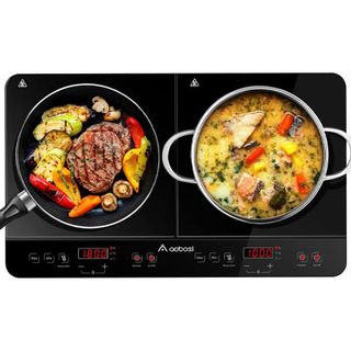 black portable induction hob with two pans cooking and digital displays