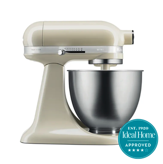 A cream KitchenAid mixer with a blue Ideal Home 5 star approved badge 