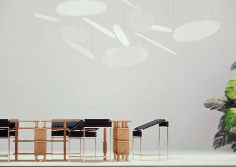 A modern minimalist room with a wooden table and black chairs. Circular ceiling lights cast shadows