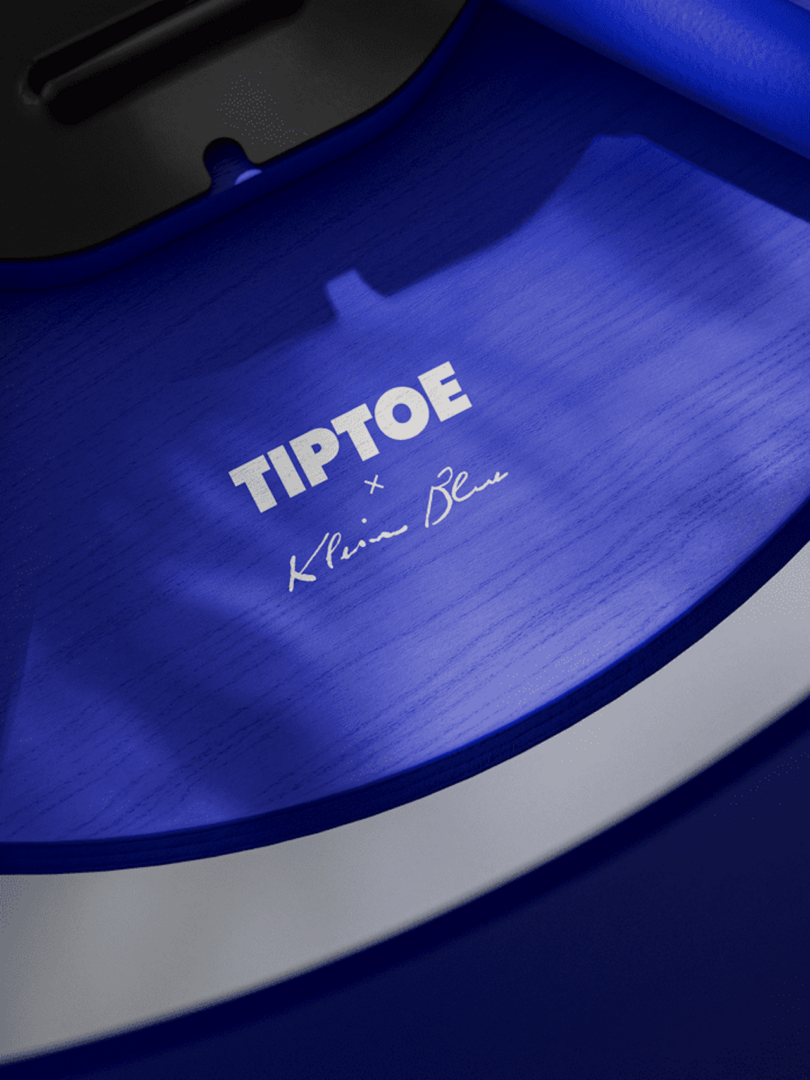 Close-up of a blue surface with "TIPTOE x Klein Blue" printed in white