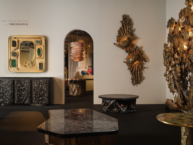 Contemporary art gallery with sculptures and unique furniture pieces displayed against neutral walls