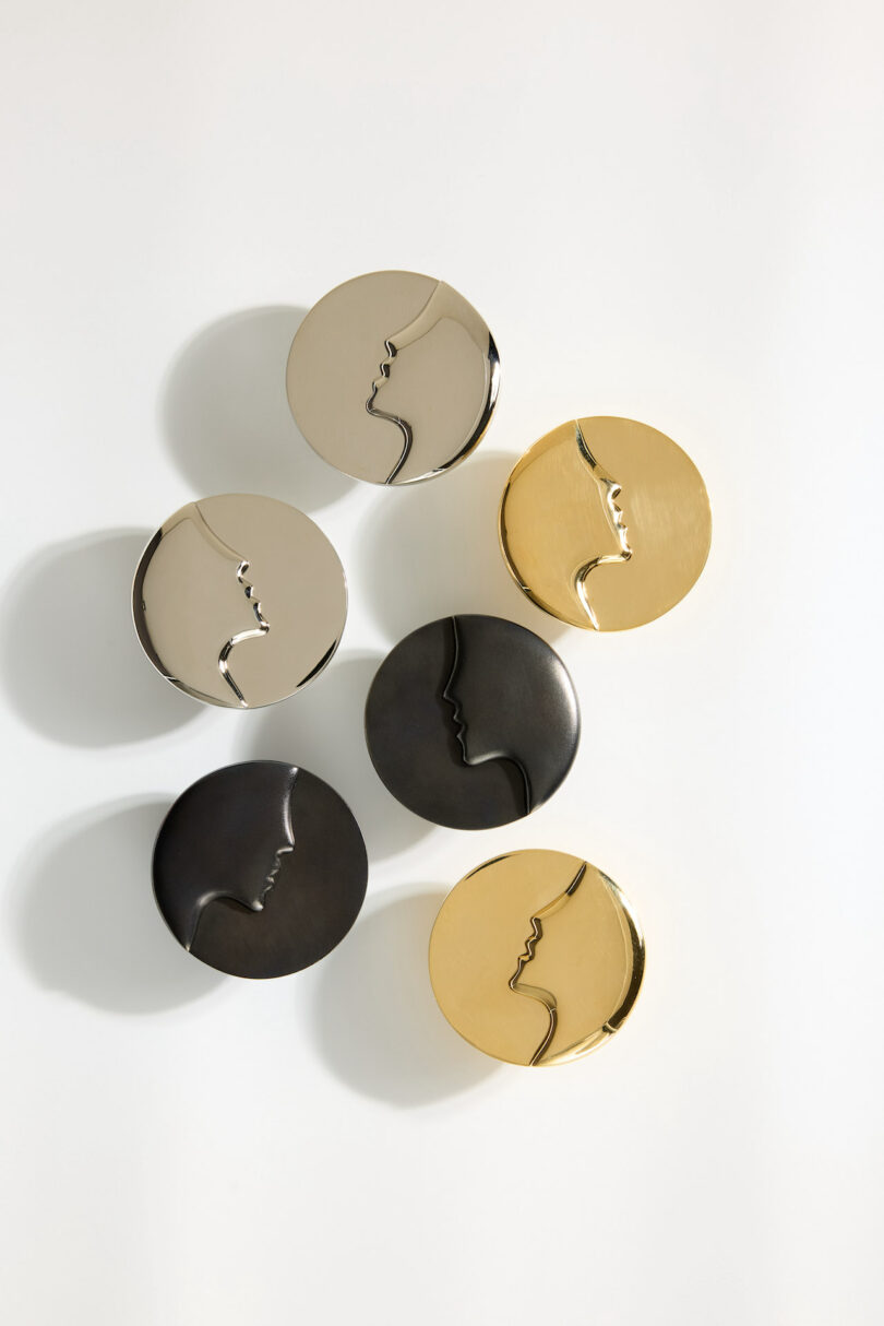 A collection of gold, silver, and black geometric hardware on a white background