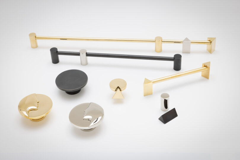 A collection of gold, silver, and black geometric hardware on a white background