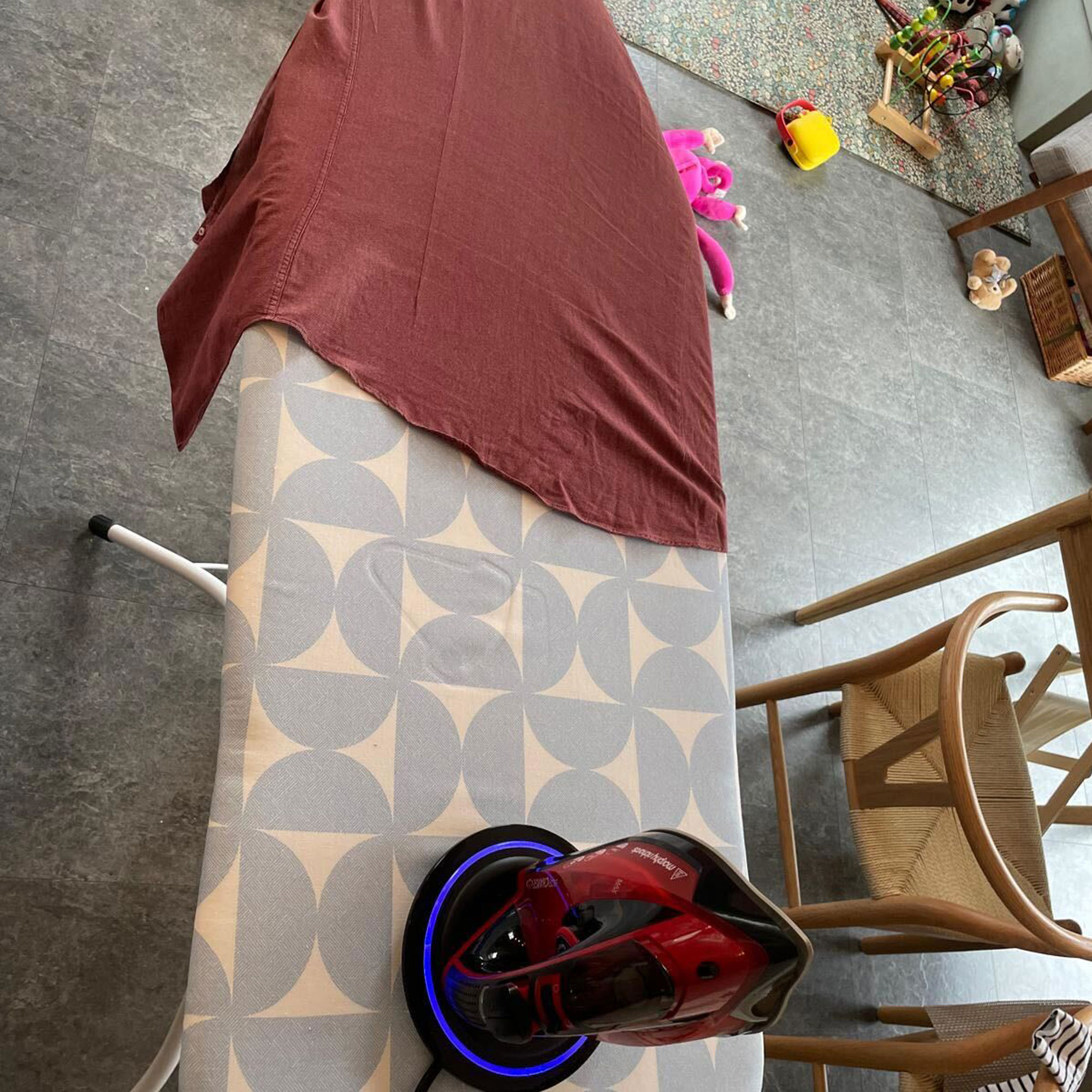 morphy richards iron with red shirt on ironing board