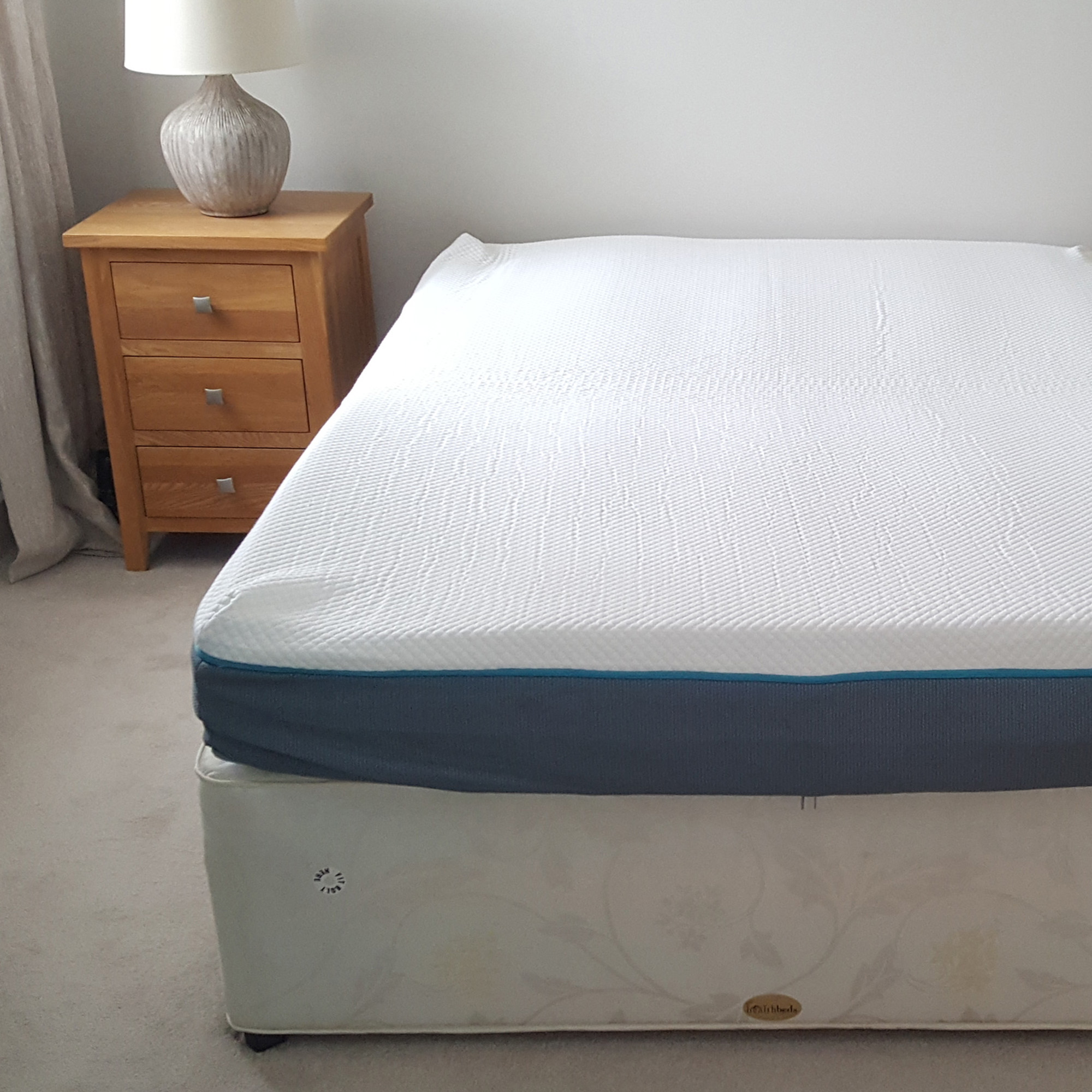 The Simba Hybrid Original mattress being tested in a bedroom with a divan bed base