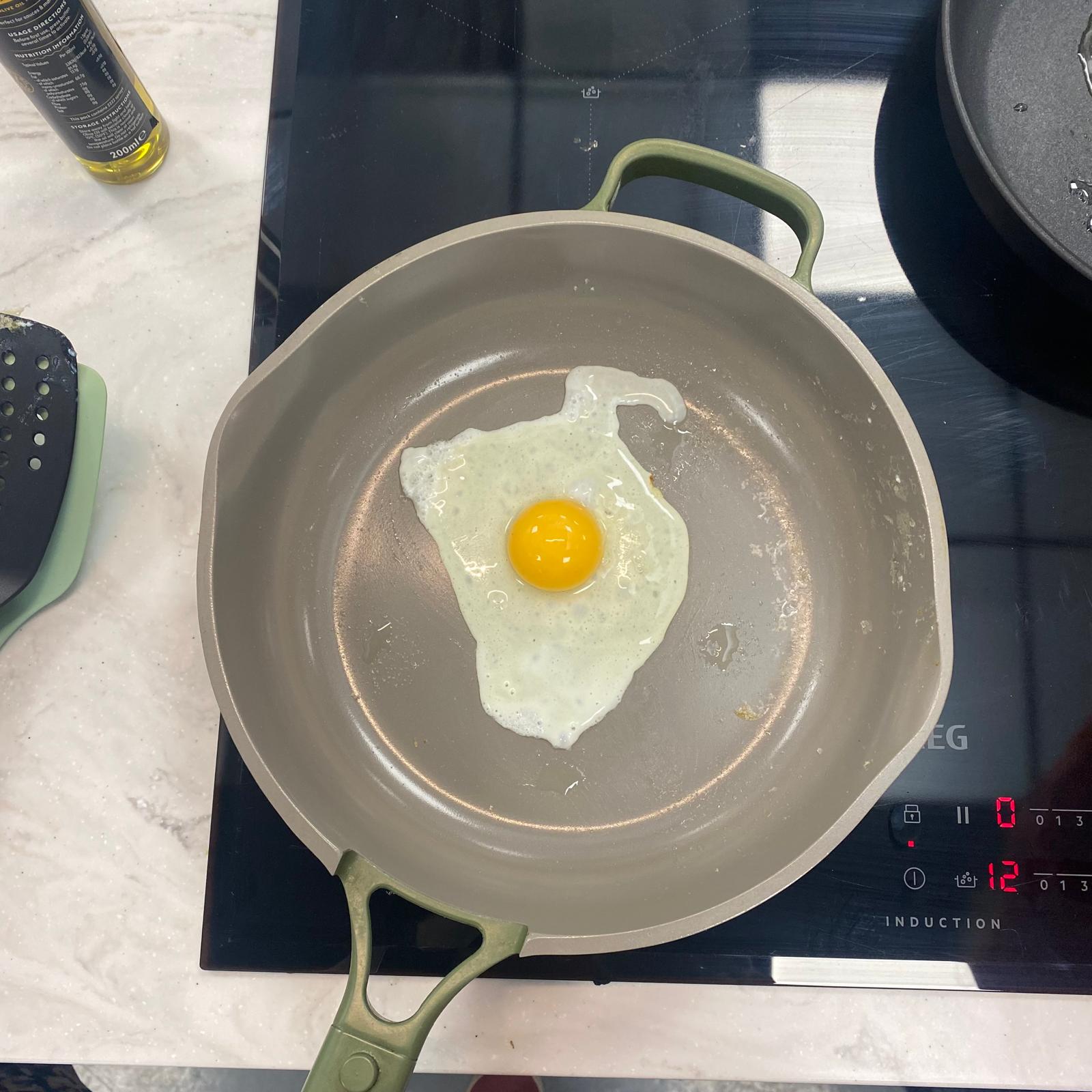 Testing the Our Place Always Pan at the test centre by cooking a fried egg 