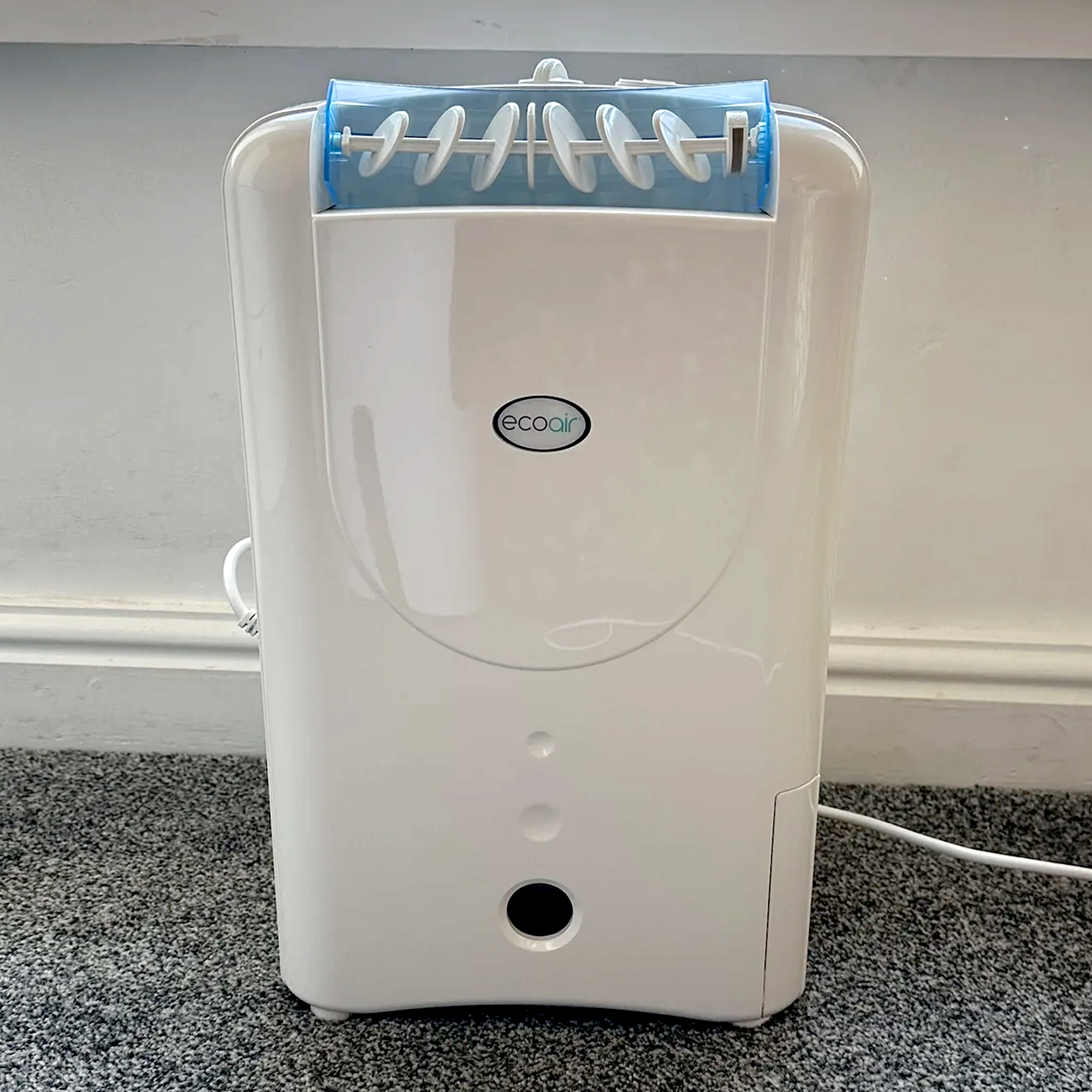 The EcoAir DD1 Simple MK3 Dehumidifier on a grey carpet