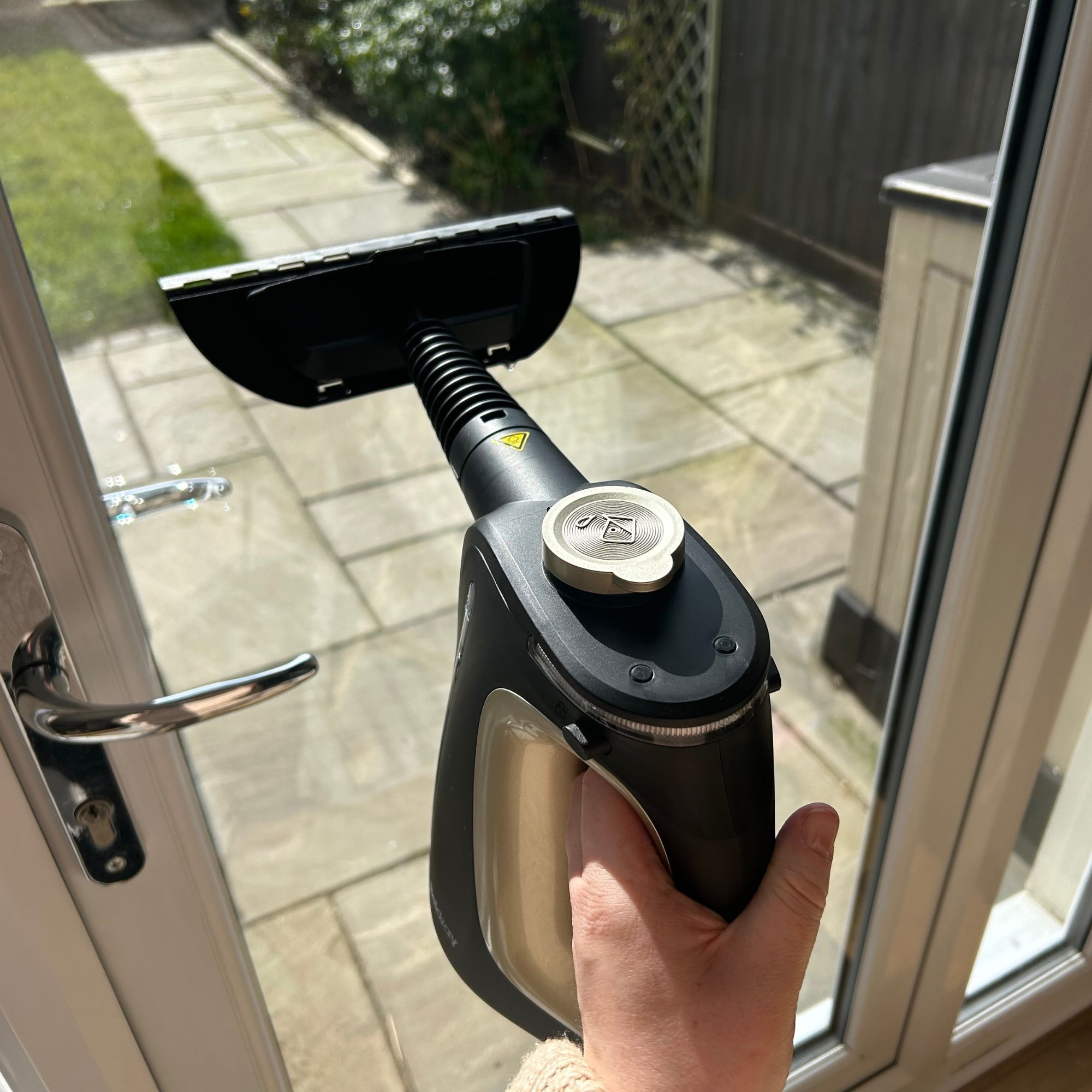 Beldray steam cleaner with window squeege attachment using on patio doors