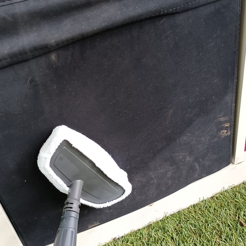 Vax Steam Fresh Combi S86-SF-C Steam Mop being used on a sun lounger