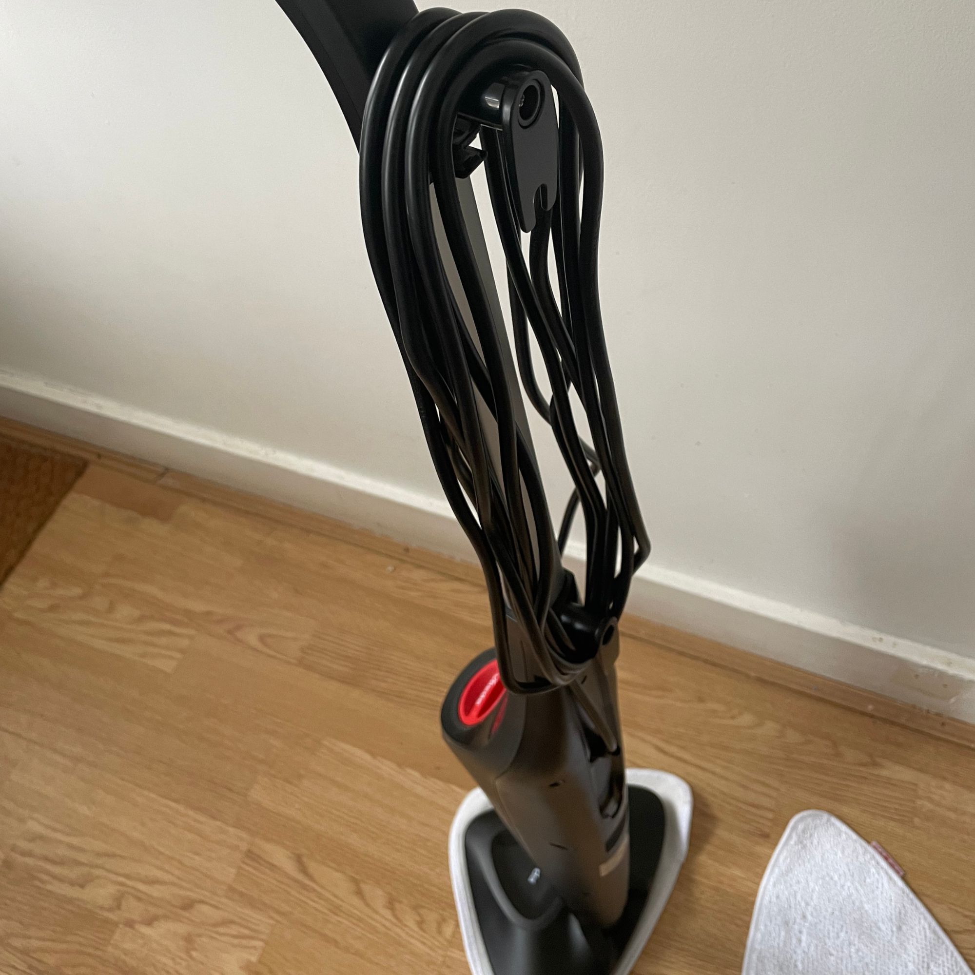 Vileda Steam Mop Plus with the cord wrapped around the cord holder