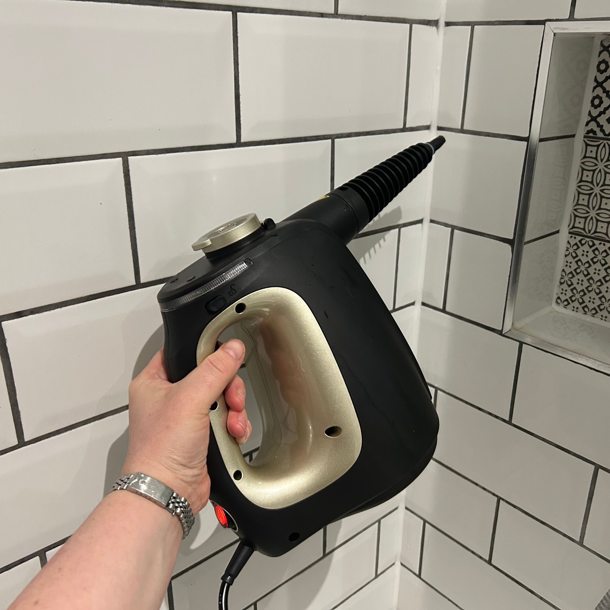 Beldray steam cleaner with general nozzle in shower with metro tiles