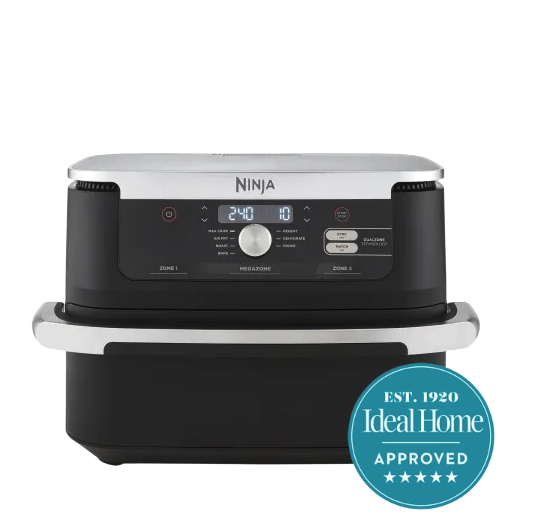 A large Ninja air fryer with a silver handle on a white background, with the 5 star Ideal Home approved badge in the right hand corner 
