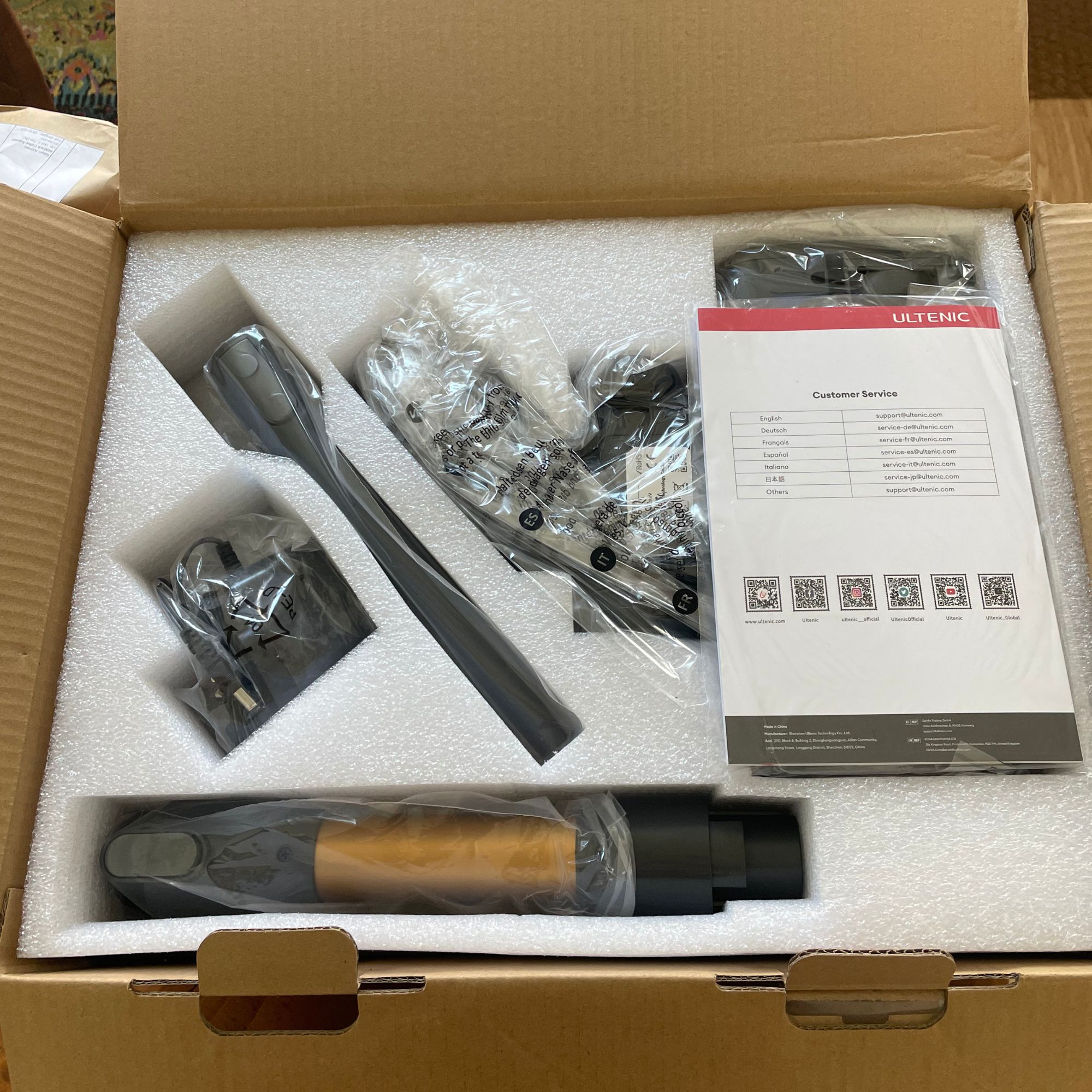 Open box of the Ultenic U20 cordless vacuum, revealing the components inside polystyrene 
