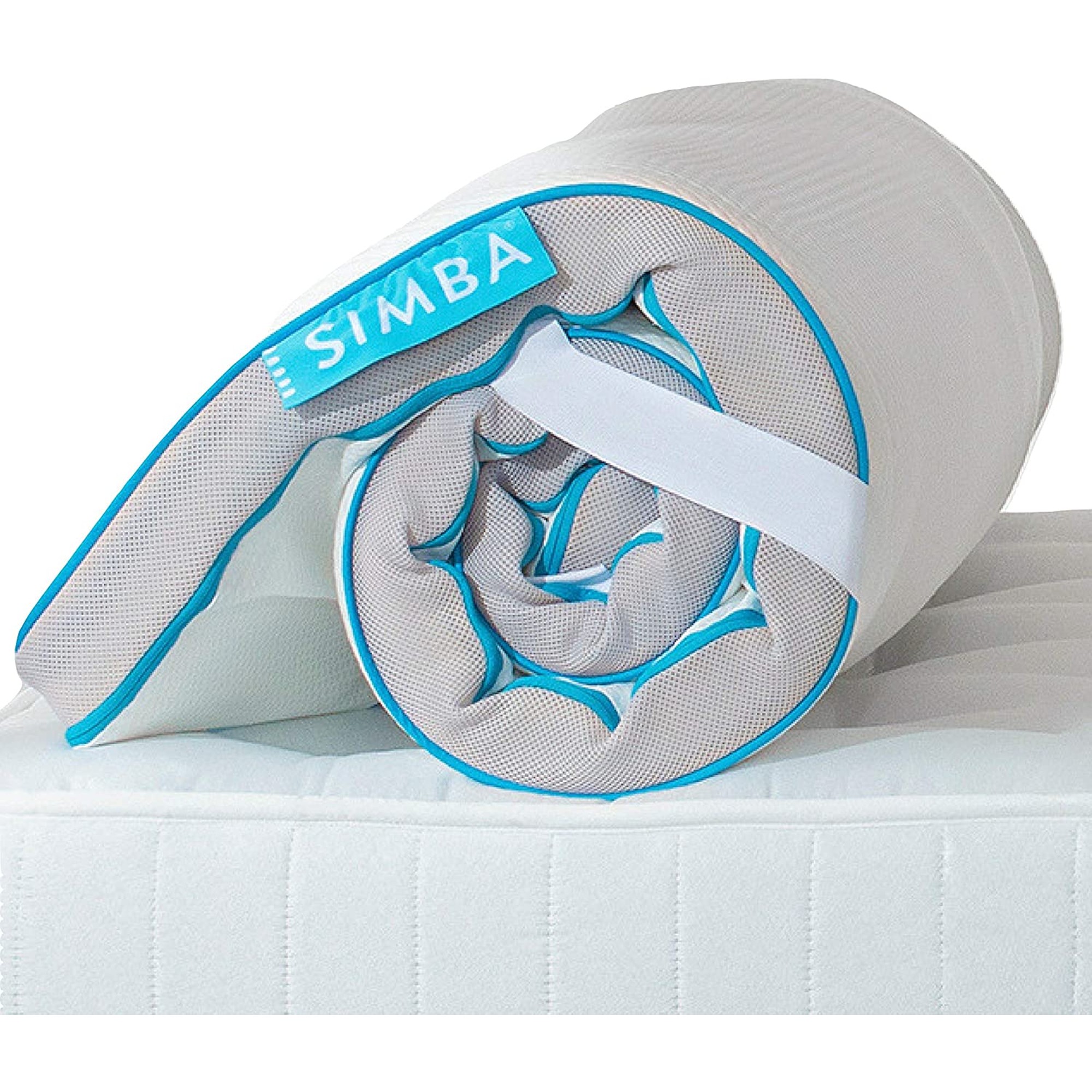 Simba mattress topper rolled up on a bed